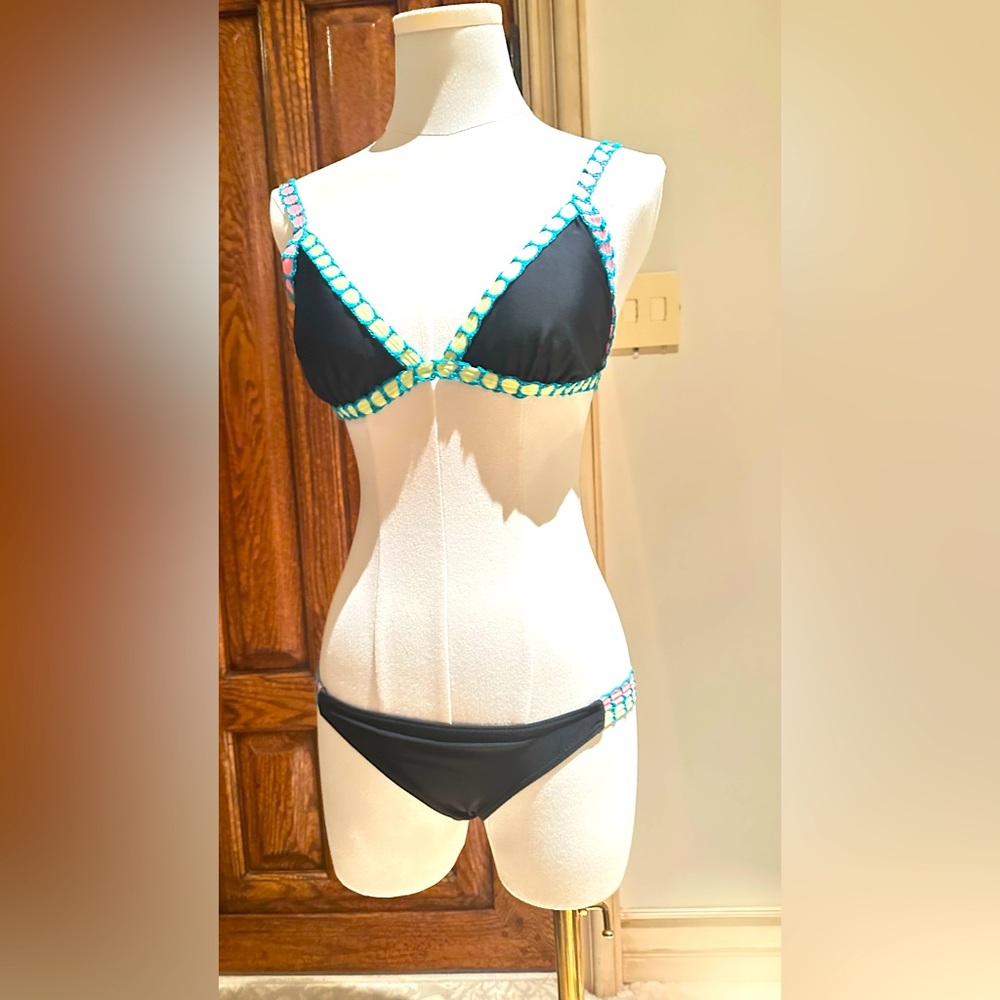 Black Bikini with Blue and pink green yellow Accents
Top size M
Bottom size XS